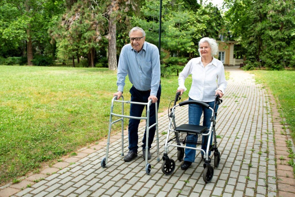 Couple using a walker outside